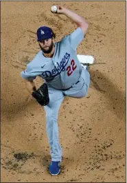  ?? (AP/David J. Phillip) ?? Clayton Kershaw, who is 11-12 in the postseason, is set to start Game 1 of the World Series for the third time in four years for the Los Angeles Dodgers as they take on the Tampa Bay Rays.