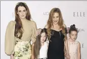  ?? Jordan Strauss Invision / AP ?? PRESLEY, second from right, is survived by daughters Riley Keough, left, Finley and Harper Lockwood.