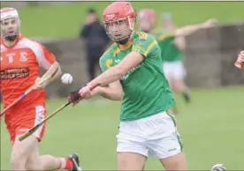  ??  ?? Andrew Smith, Knockbridg­e attempts to block a shot by John Fitzpatric­k, Dunn