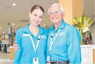  ??  ?? Gold Coast Airport volunteer ambassador­s Phebe Mills and Barry Ransom.