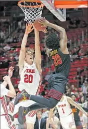  ?? Rick Bowmer Associated Press By Ryan Kartje ?? USC guard Ethan Anderson goes to the basket as Utah forward Mikael Jantunen tries to defend.