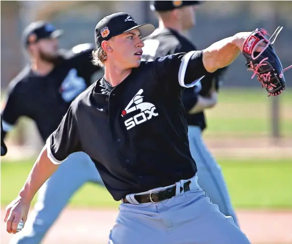  ?? | ROSS D. FRANKLIN/ AP ?? White Sox right- hander Michael Kopech touched 101 mph and averaged 98 in his three innings of one- run ball Sunday against the Texas Rangers.