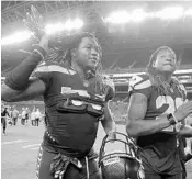  ?? STEPHEN BRASHEAR/ASSOCIATED PRESS ?? Seahawks twins Shaquem Griffin, left, and Shaquill Griffin leave the field following Thursday’s preseason game.
