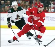  ?? DUANE BURLESON — THE ASSOCIATED PRESS ?? Detroit Red Wings center Dylan Larkin (71) takes the puck past Arizona Coyotes center Jack McBain (22) during the first period of Friday’s game in Detroit.