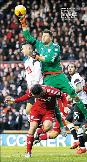  ?? PICTURE: Action Images ?? MAKE A FIST OF IT: Derby’s Jason Shackell in action with Cardiff keeper David Marshall