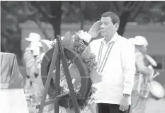  ?? ASSOCIATED PRESS ?? President Rodrigo Duterte salutes at the Tomb-of-the-UnknownSol­dier during wreath-laying rites to mark National Heroes Day at the Heroes Cemetery in Taguig City.