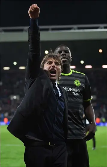  ??  ?? Manager Antonio Conte celebrates after Chelsea clinched the Premier League title on Friday night.