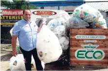  ?? CONTRIBUTE­D PHOTOS ?? Nicholas McKoy of Chad-Ad stands proudly with a collection of plastics collected by Chad-Ad Distributo­rs in Newport West.