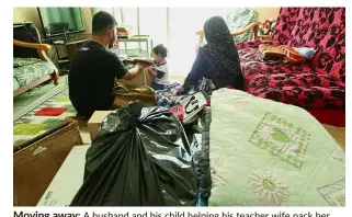  ??  ?? Moving away: A husband and his child helping his teacher wife pack her bags after she is given an outstation posting.