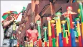  ?? ?? A street vendor blows a vuvuzela in Yaounde on Saturday.