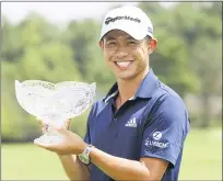  ?? DARRON CUMMINGS — THE ASSOCIATED PRESS ?? Collin Morikawa holds his trophy after winning the Workday Charity Open on Sunday in Dublin, Ohio.