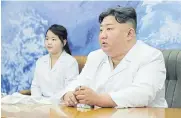  ?? AFP ?? North Korean leader Kim Jong-un and his daughter Ju-ae meet with the Non-permanent Satellite Launch Preparator­y Committee on May 17.