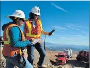  ?? Javier Mendoza
Southern Calif. Gas Co. ?? SONIA RODRIGUEZ, left, and Bonnie Feemster measure methane levels in the air.