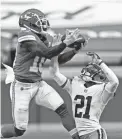  ?? CHARLIE RIEDEL/AP ?? Chiefs wide receiver Tyreek Hill makes a catch over Browns cornerback Denzel Ward on Sunday in Kansas City.