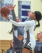  ?? KELLY MARSH/FOR THE TIMES HERALD-RECORD ?? Pine Bush’s Ketura Rutty shoots through a Millbrook defender during the Section 9 BCANY Coaches vs. Cancer tournament at Monroe-Woodbury High School in Central Valley on Jan. 7, 2023.