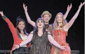  ?? Picture: CHRIS GERTSCH ?? LIGHTS, CAMERA, ACTION: Melissa Leander, Hannah Stiglingh and Taryn Bigge, front, and Jason-Lee Vermaak, back, perform a piece from ‘The Greatest Showman’, part of the Gilbert and Sullivan Society’s latest production, ‘Mind My Broadway’, at the Savoy Theatre