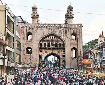 ?? — DEEPAK DESHPANDE ?? Ahead of Id-ul-Fitr, expected to be celebrated on May 14, depending on the sighting of the moon, Muslims throng the Charminar area for festival shopping, in Hyderabad on Wednesday.