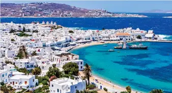  ?? ?? Gleaming: Mykonos town. Below, Hotel Santa Marina and island fan Kate Moss