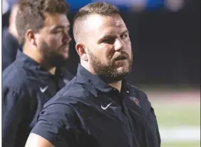  ?? (Arkansas Democrat-Gazette/Justin Cunningham) ?? Maumelle Coach Brian Maupin was able to join his team for overtime Friday against Watson Chapel upon completing his four-quarter suspension after being ejected from Maumelle’s game against Morrilton on Oct. 14.