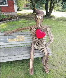  ?? COURTESY OF THE TOWN OF HUDSON ?? Hudson resident and artist Daniel Gauthier used found materials such as driftwood to create this tribute to the volunteers who came to the aid of victims of recent flooding on the West Island. Wearing a bright red heart and a canoe chapeau, the...