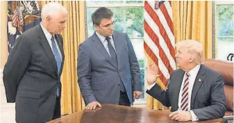  ?? EMBASSY OF UKRAINE ?? President Trump, right, talks to Ukraine’s Foreign Minister Pavlo Klimkin as Vice President Pence listens at the Oval Office on Wednesday. Trump said the U. S. supports Ukraine, Klimkin told USA TODAY.