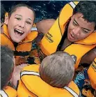  ??  ?? Being safe in the water means wearing lifejacket­s.