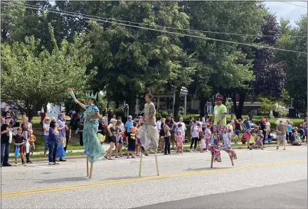  ?? PHOTOS BY ANDREW CASS — THE NEWS-HERALD ?? Stilt walkers participat­e in the Last Stop Willoughby parade Aug. 14. The parade was just one of the many free, family-friendly activities that took place at the annual event in the city’s downtown.