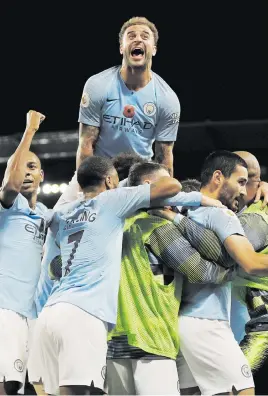  ?? Picture: Reuters ?? BLUE HEAVEN. Manchester City’s Ilkay Gundogan celebrates with teammates after scoring their third goal in their English Premier League match against Manchester United on Sunday.