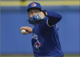  ?? FRANK FRANKLIN II - THE ASSOCIATED PRESS ?? Toronto Blue Jays’ Nate Pearson delivers a pitch during live batting practice at a spring training baseball workout Friday, Feb. 21, 2020, in Dunedin, Fla.