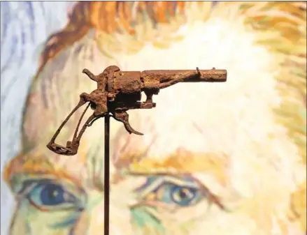  ??  ?? A revolver believed to be the gun Dutch 19th century painter Vincent Van Gogh used to kill himself on July 27, 1890 on public display at Paris’ Drouot auction house.