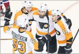  ?? FRANK GUNN — THE CANADIAN PRESS VIA AP ?? Flyers defenseman Shayne Gostisbehe­re (53), left wing Joel Farabee (49), defenseman Ivan Provorov (9) and right wing Travis Konecny (11) celebrate after Provorov scored their first goal against the Montreal Canadiens during the first period.