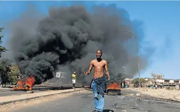  ?? Picture: KB MPOFU ?? BULAWAYO BURNING: Scenes like this one were common across Zimbabwe this week as people took to the streets to protest against the banning of basic consumer goods from South Africa