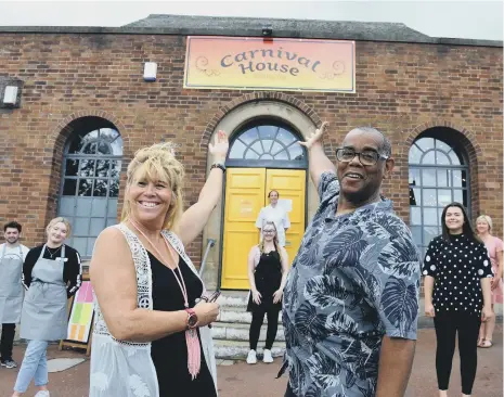  ??  ?? Sandy and Garner Harris with the team at the opening of the Carnival House.