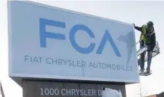  ?? — Reuters ?? A new Fiat Chrysler Automobile­s sign is unveiled at Chrysler Group World Headquarte­rs in Auburn Hills, Michigan.