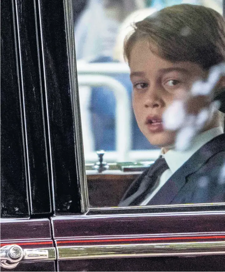  ?? ?? Prince George and Princess Charlotte travel to Westminste­r Abbey for the funeral of their greatgrand­mother