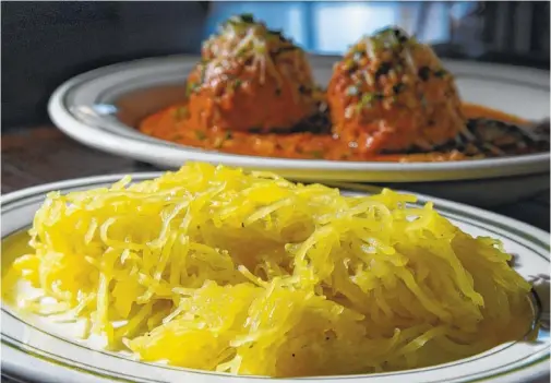  ?? STAFF PHOTO BY ANGELA LEWIS FOSTER ?? Spaghetti squash is paired with dry, aged Barton Creek meatballs with Sunday sauce at Il Primo restaurant in Riverview.