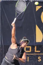  ?? JIM THOMPSON/JOURNAL ?? Ivana Corley serves during a doubles match at the Coleman Vision Tennis Championsh­ips in September. Ivana and her sister Carmen won wild-card exemptions to play in the tournament. The sisters won a main-draw match.