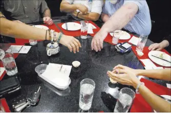  ?? LOREN TOWNSLEY/LAS VEGAS REVIEW-JOURNAL FOLLOW @LORENTOWNS­LEY ?? Guests enjoy the tea at Niu-Gu restaurant during a recent event that showed how various types of tea could be paired with dishes on the menu.
