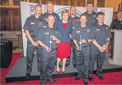  ??  ?? EXEMPLARY: First Minister Nicola Sturgeon along with some of the Brave At Heart award recipients