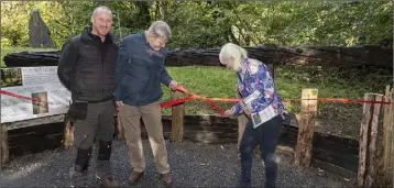  ??  ?? David Carroll and his sister Elizabeth Quigley (nee Carroll) cut the ribbon at the unveiling, with Heritage Park manager, Chris Hayes.