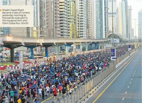  ?? Virendra Saklani/Gulf News ?? ■ Shaikh Zayed Road became a sea of runners yesterday morning as thousands took part in the inaugural 5km and 10km Dubai Run 30x30.