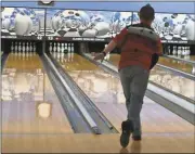  ??  ?? Sarah Lane /
Rome News-Tribune
Ben Cook bowls a strike Saturday at Classic Lanes Bowling.