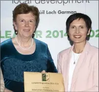  ??  ?? Cllr Kathleen Codd Nolan makes the presentati­on to Aine Jackman of Adamstown Community Centre.