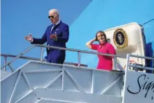  ?? AP PHOTO/PATRICK SEMANSKY ?? On Thursday, President Joe Biden steps off Air Force One with Rep. Kathy Castor, D-Fla. Biden is visiting Tampa to speak about plans to protect Social Security and Medicare and lower healthcare costs.