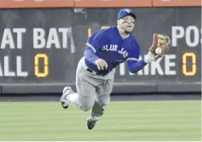  ?? BILL KOSTROUN/THE ASSOCIATED PRESS ?? Steve Pearce makes a catch on a ball hit by the Yankees’ Chase Headley on Wednesday in New York.