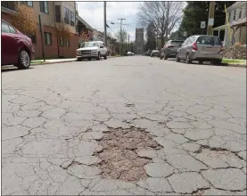  ?? DAN SOKIL - MEDIANEWS GROUP ?? Cracks in the roadway can be seen on North Richardson Avenue, facing south toward Main Street between Second and Third Streets, on Thursday.