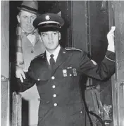  ?? JAMES REID/AP ?? Elvis Presley and Colonel Tom Parker step off the train in Memphis, Tennessee, in 1960 following Presley’s discharge from the Army.