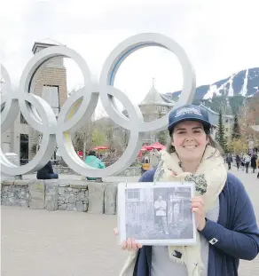  ?? — ANDREW MCCREDIE ?? Whistler walking tour guide Jeanette Bruce holds a photo of Texan John Millar, one of the first settlers in the area who arrived exactly a century before the 2010 Winter Olympics.