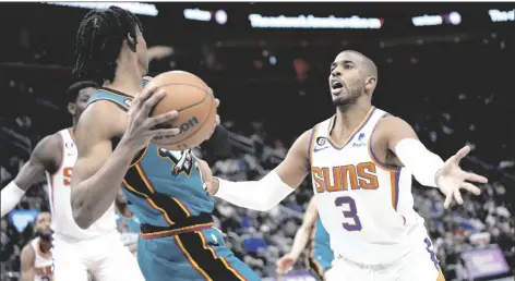  ?? Saturday. PAUL SANCYA/AP ?? PHOENIX SUNS GUARD CHRIS PAUL (3) defends Detroit Pistons guard Jaden Ivey (23) in the second half of a game in Detroit on