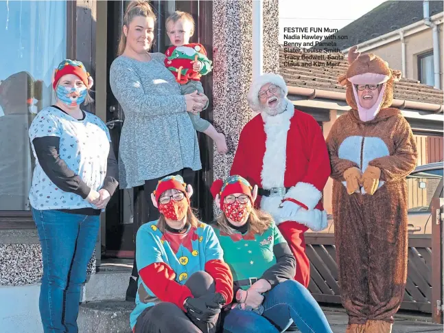  ??  ?? FESTIVE FUN Mum Nadia Hawley with son Benny and Pamela Slater, Louise Smith, Tracy Bedwell, Santa Claus and Kim Marr.